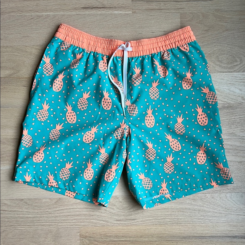 Chubbies Blue and Orange Swim Trunks with Playful Pineapple Print